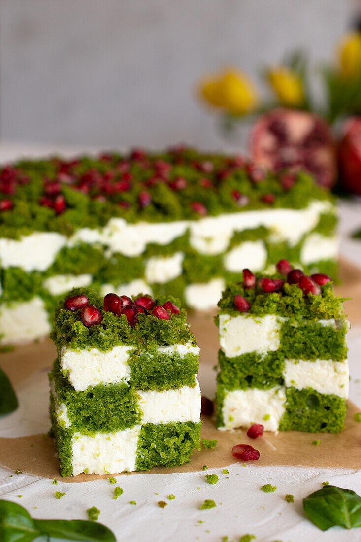 Cream cheese cake with spinach and pomegranate seeds