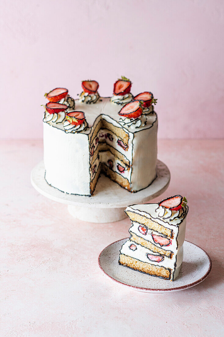 Comic-Kuchen mit Frischkäse und Erdbeeren, angeschnitten