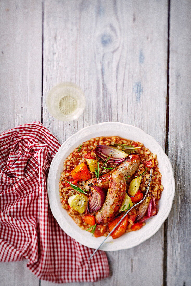 Roasted autumn vegetables with spelt and sausages