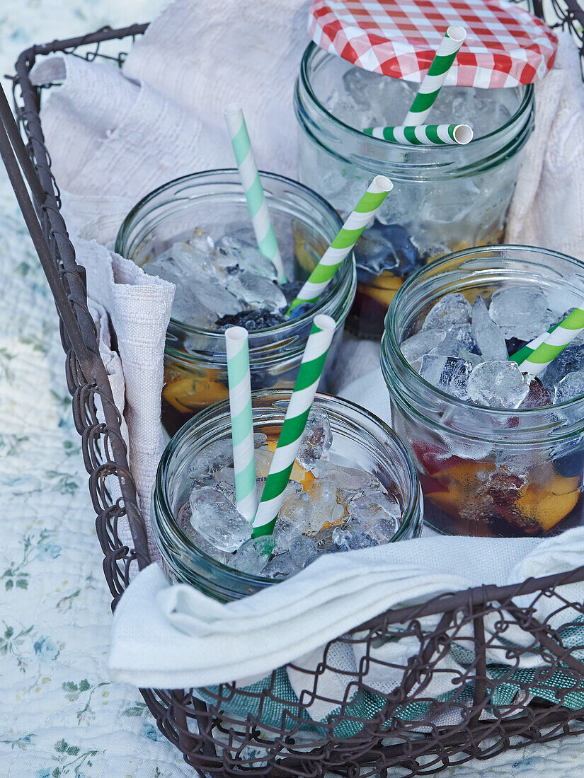 Fruit cocktail in jars with ice