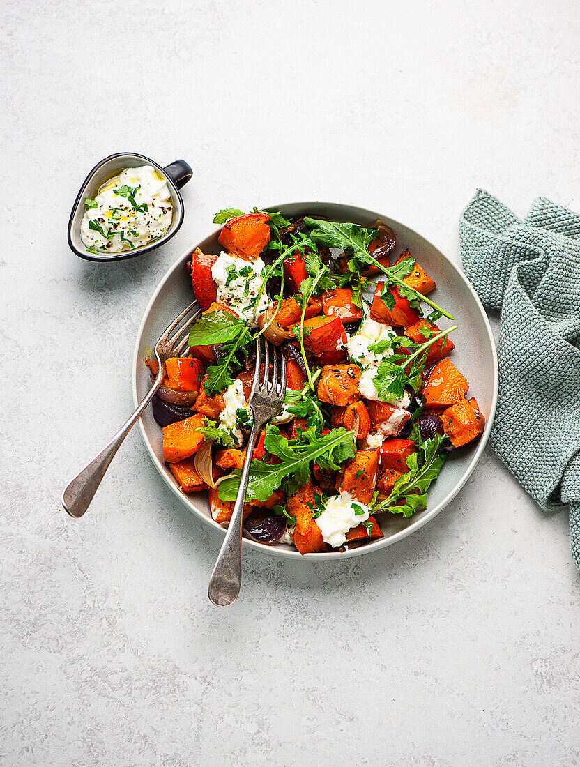 Pumpkin salad with rocket and feta sauce