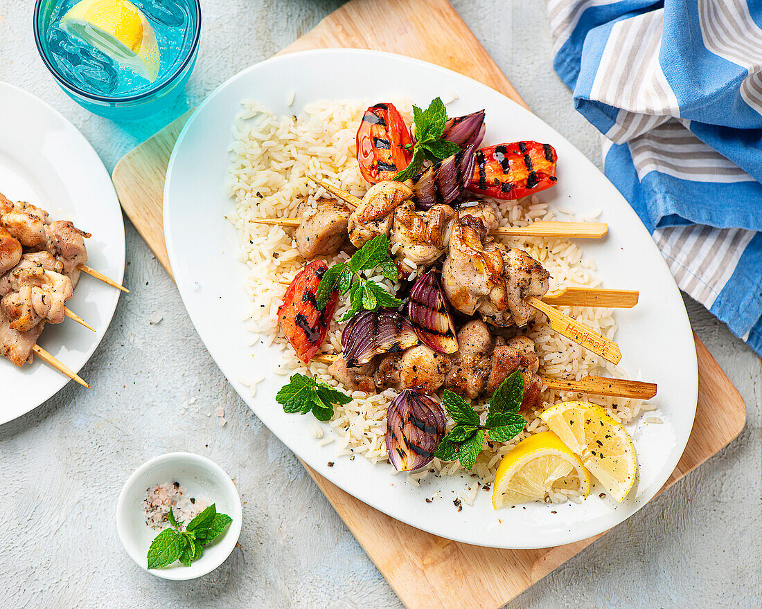 Chicken skewers with grilled vegetables and rice