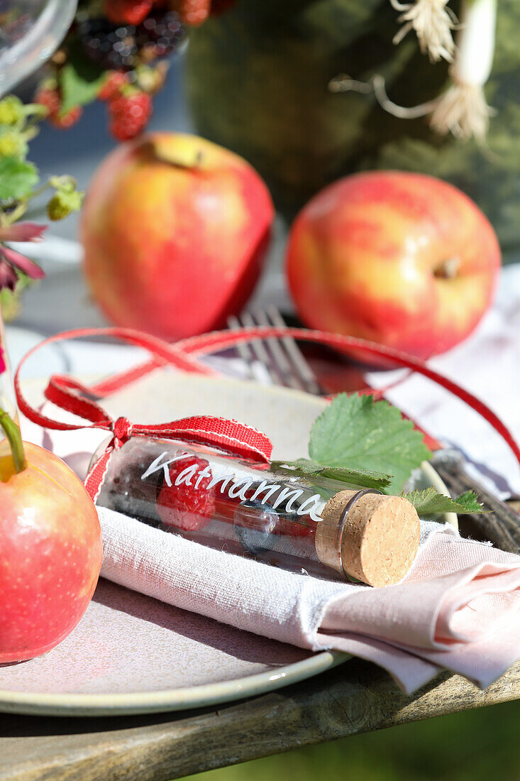 Test tubes filled with berries as place cards