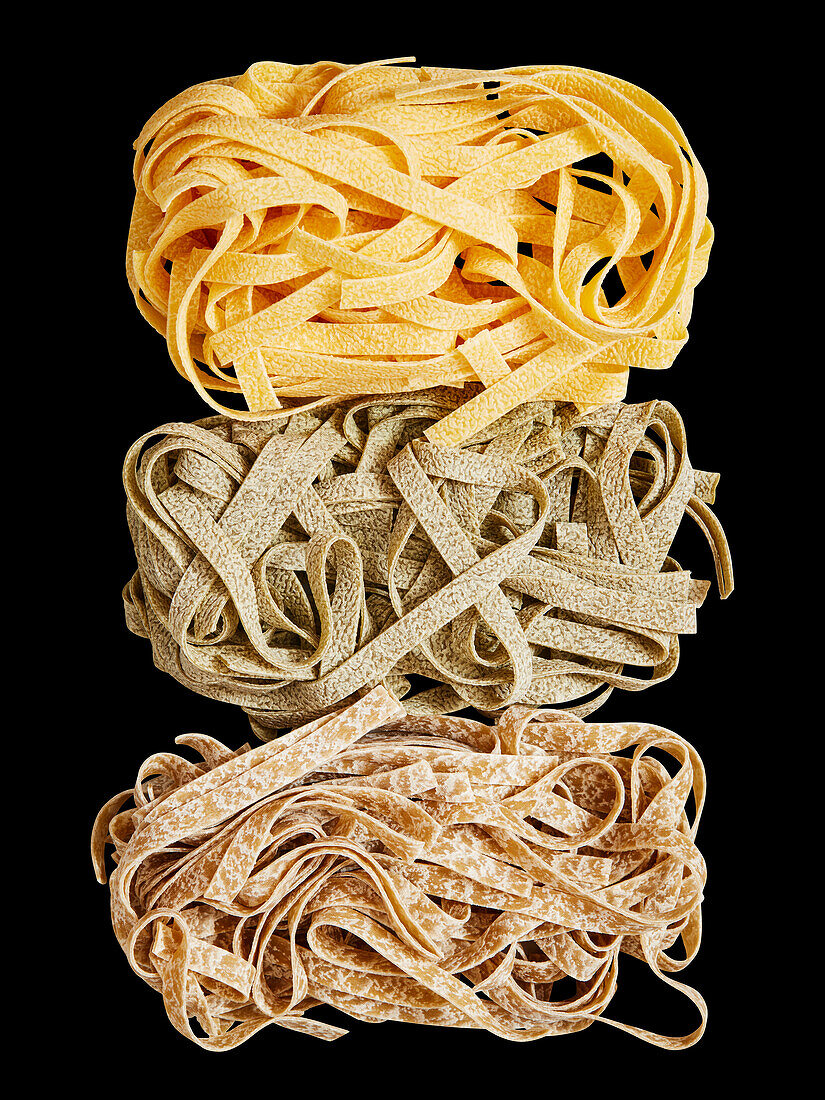 Three different kinds of tagliatelle (uncooked)