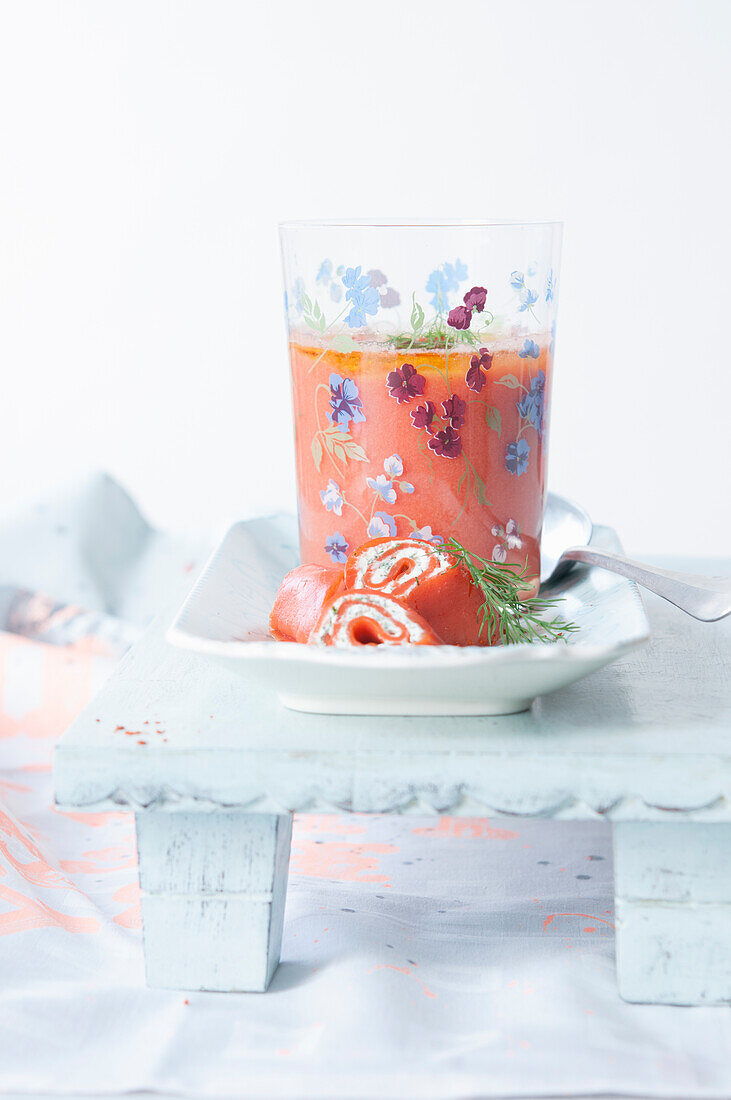 Cold tomato soup with salmon cream cheese rolls