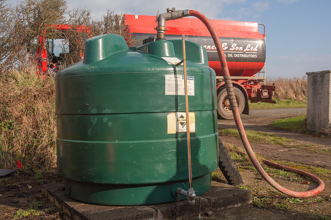 Oil being pumped from road tanker into domestic tank