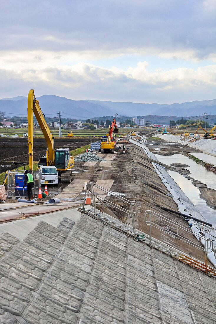 Building up sea defences after tidal wave, Kagoshima, Japan