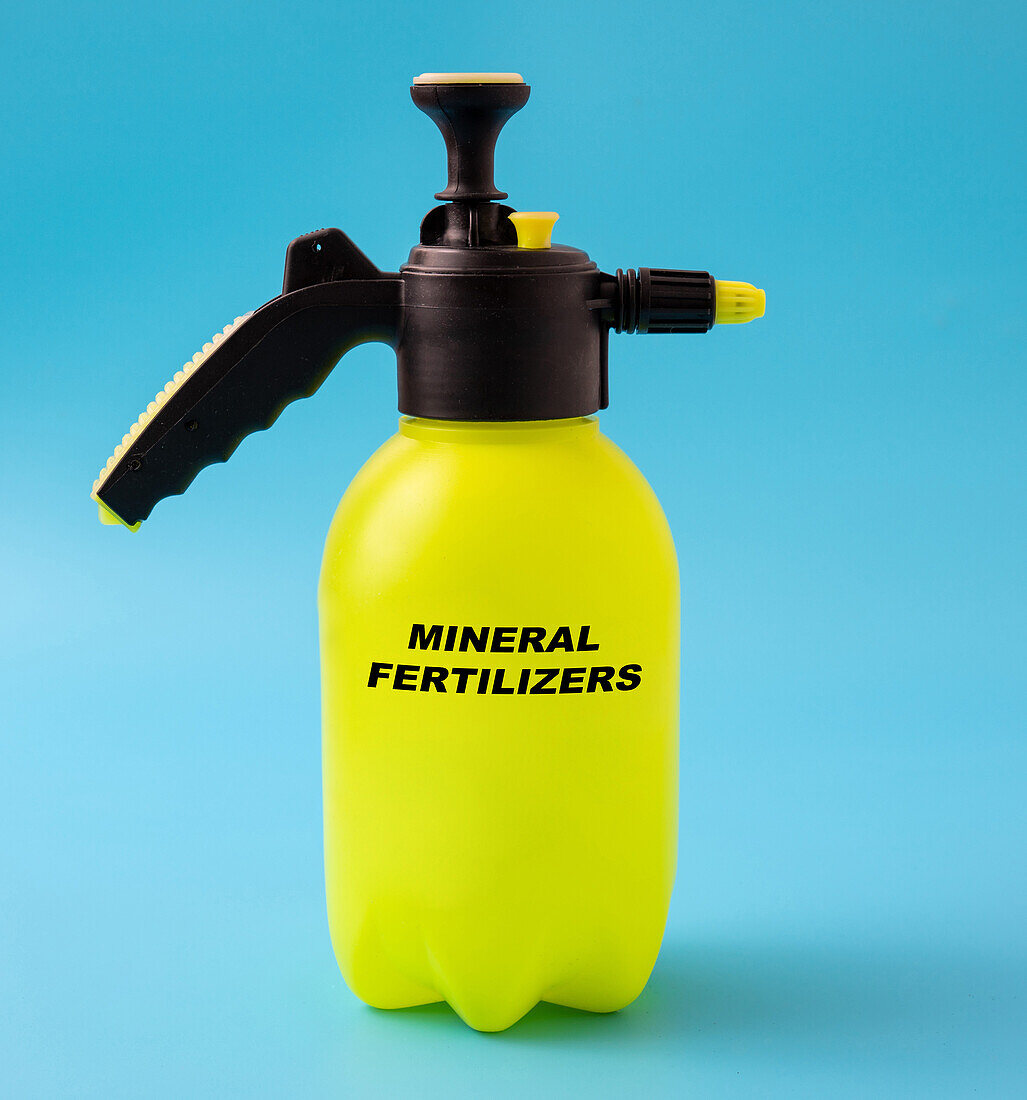 Mineral fertilizers in a plastic spray, conceptual image