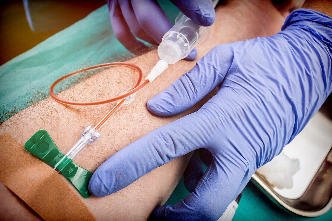 Nurse taking blood from a blood donor, conceptual image
