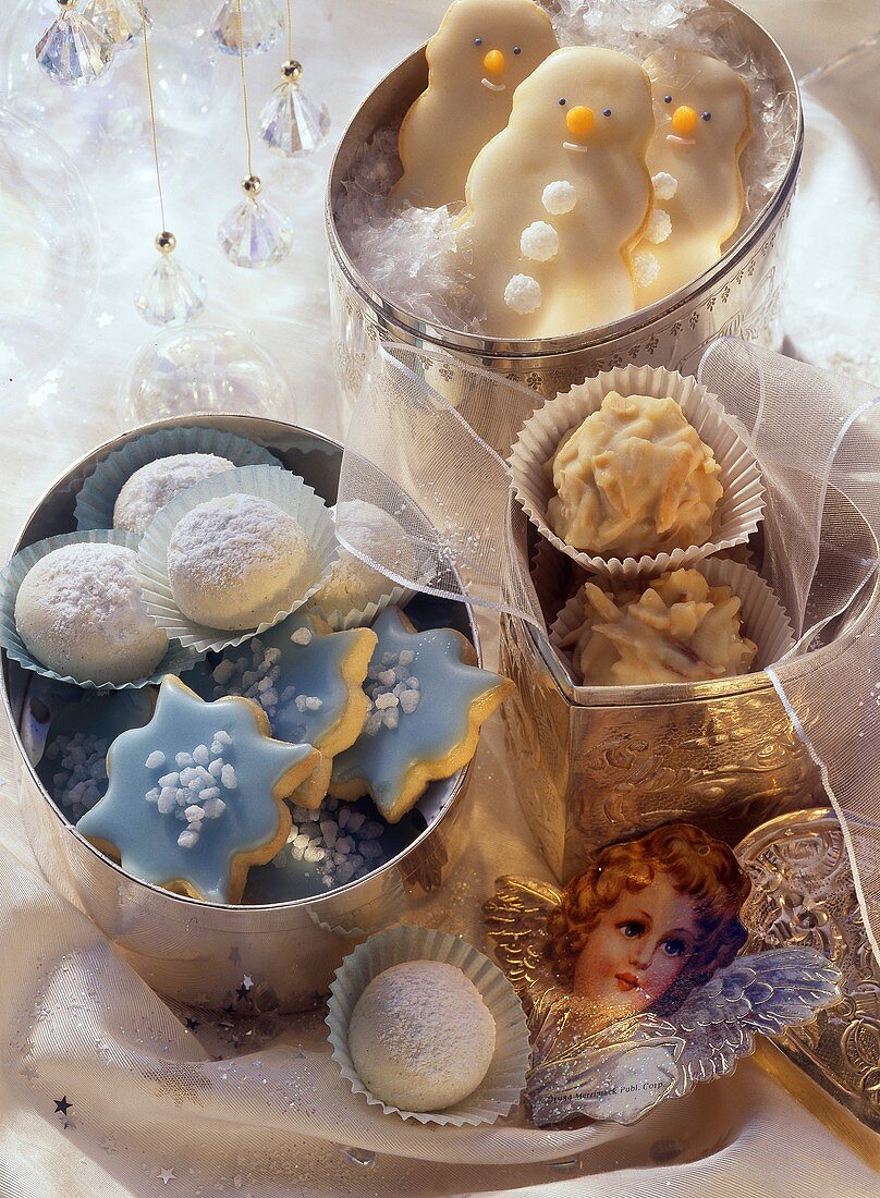 Delicate Christmas biscuits in silver boxes