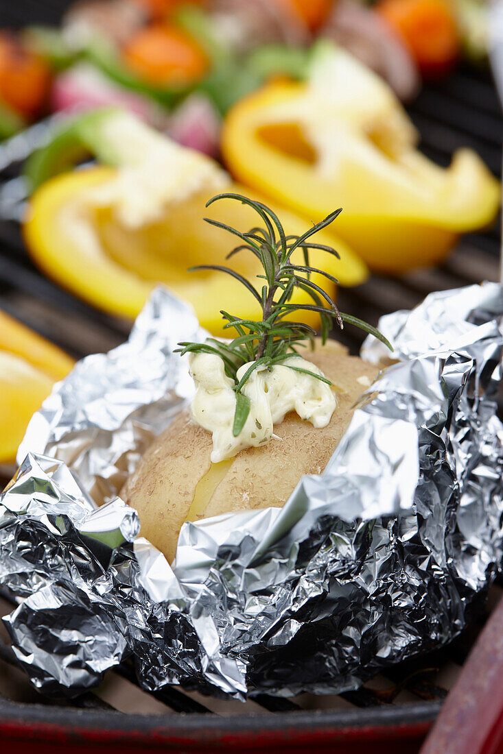 Baked potato on grill