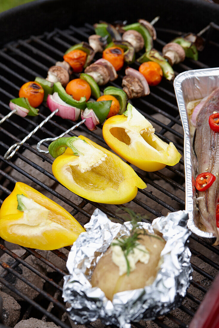 Vegetables and potato on grill