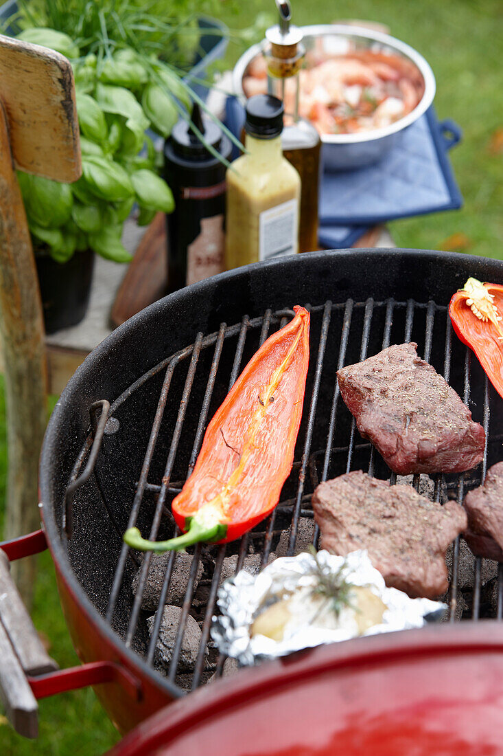 Grill with steaks and chillies