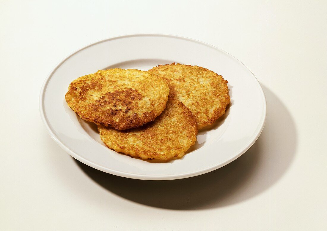 Three potato pancakes on plate