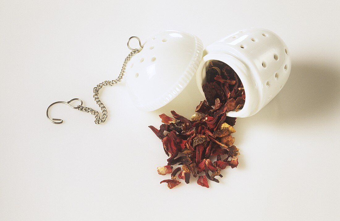 Fruit tea in porcelain tea infuser