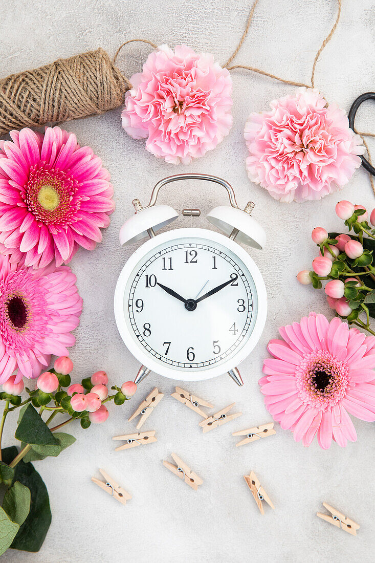 Alarm clock and cut flowers