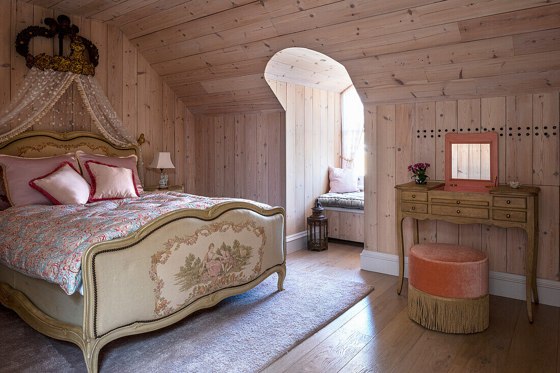 Louis XV-style bedroom with gilded bed crown and Canadian pine wall paneling