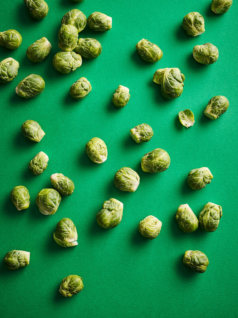 Brussels sprouts on a green background