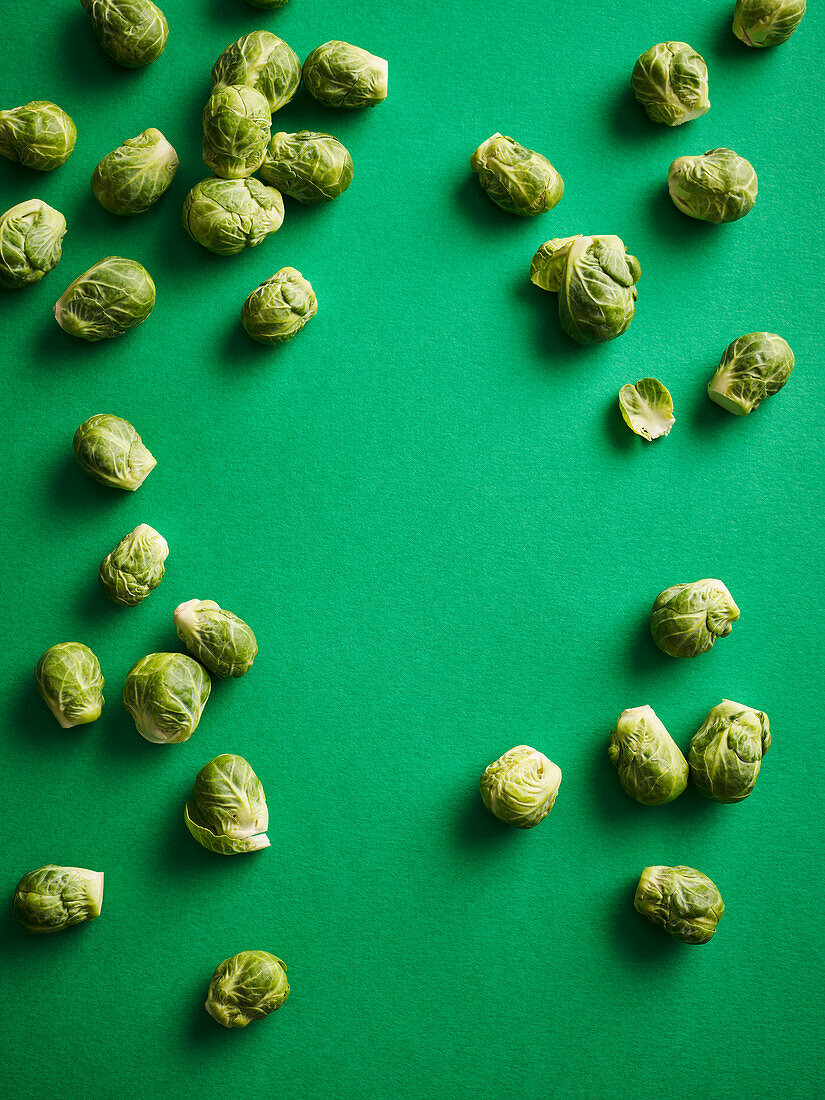 Brussels sprouts on a green background