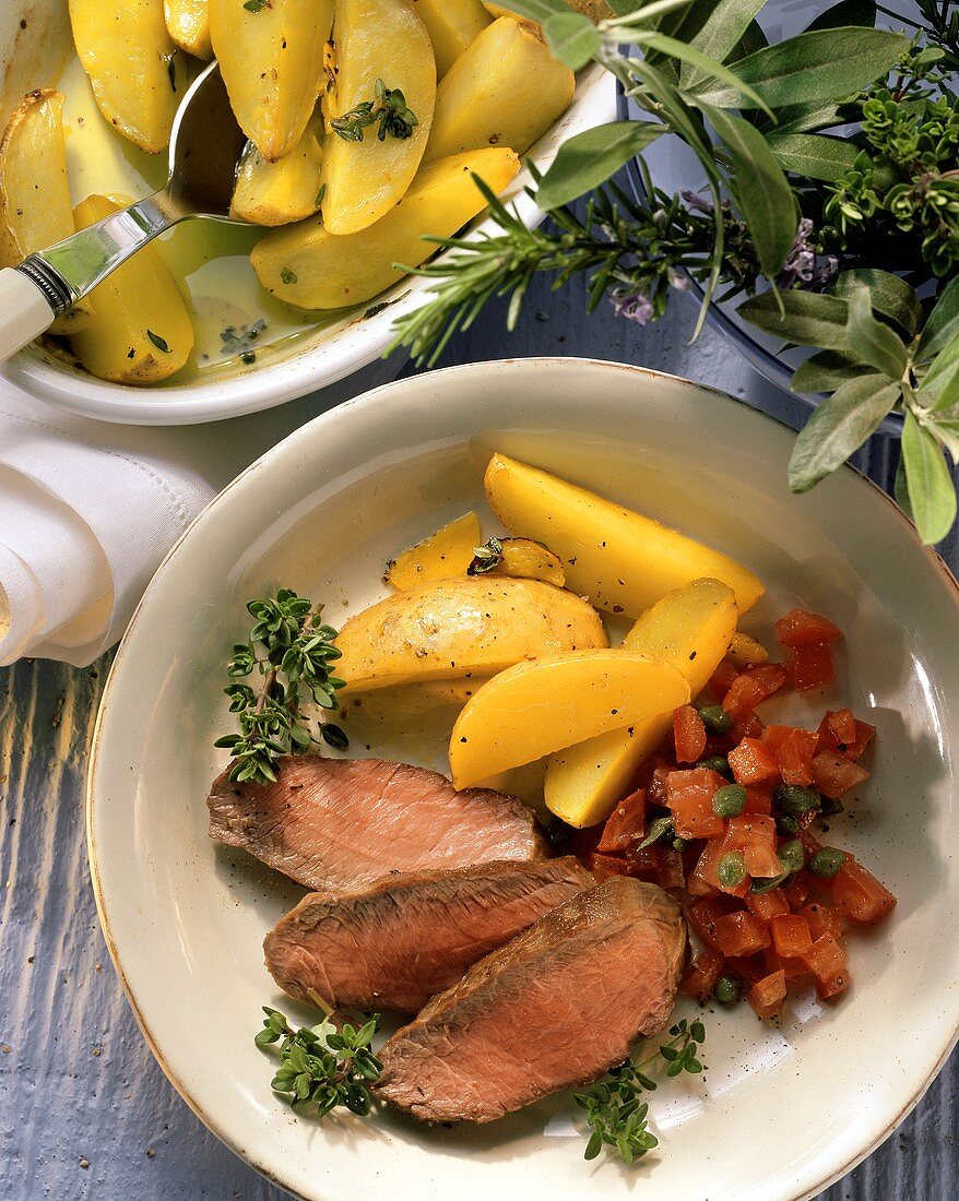 Lamb fillet with tomatoes and saffron potatoes