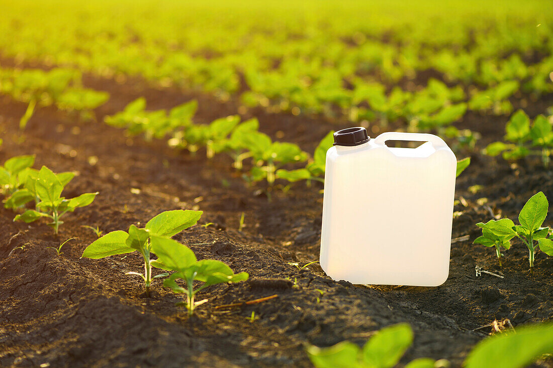 Herbicide canister in field
