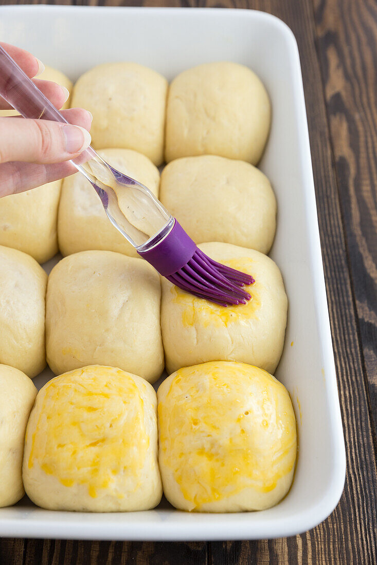 Coating dough balls with egg