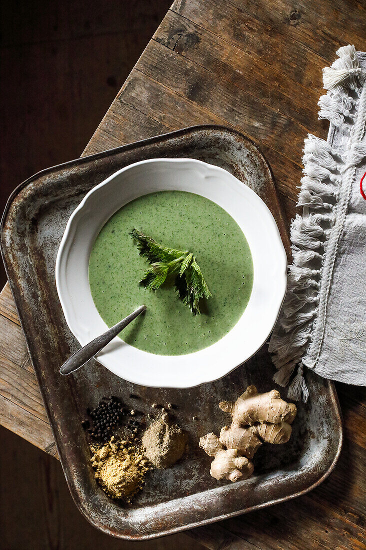 Cream of nettle soup with galangal and bertrama powder