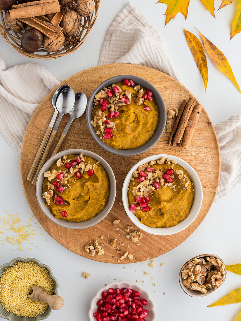Millet groats and pumpkin pudding with pomegranate seeds