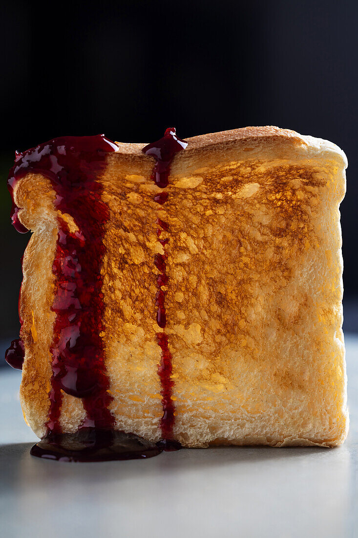 Standing toast with runny jam