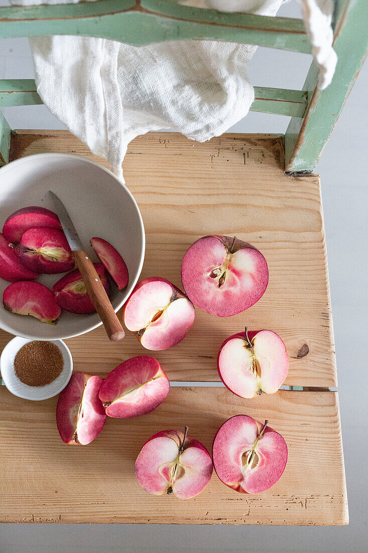 Red-fleshed apples halved and in wedges