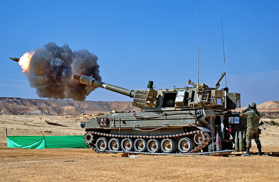 Self-propelled artillery firing a load