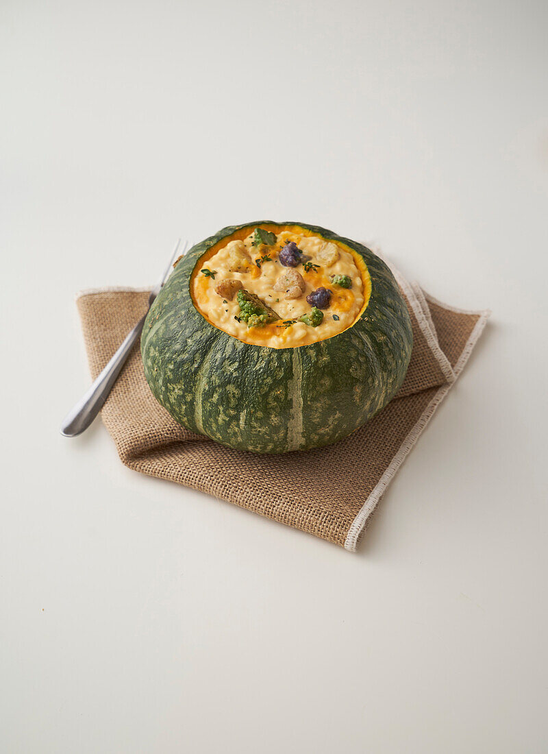 Pumpkin and cauliflower risotto in a hollowed-out pumpkin