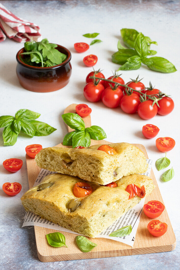 Rocket focaccia with olives and cherry tomatoes