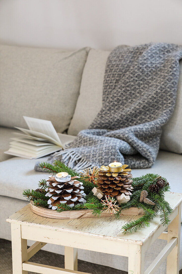 Homemade candle holder made from pine cones