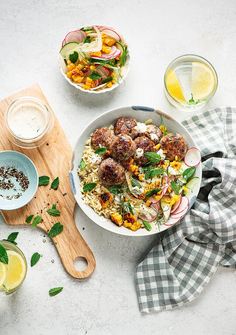 Bowl with turkey meatballs, rice and fennel salad