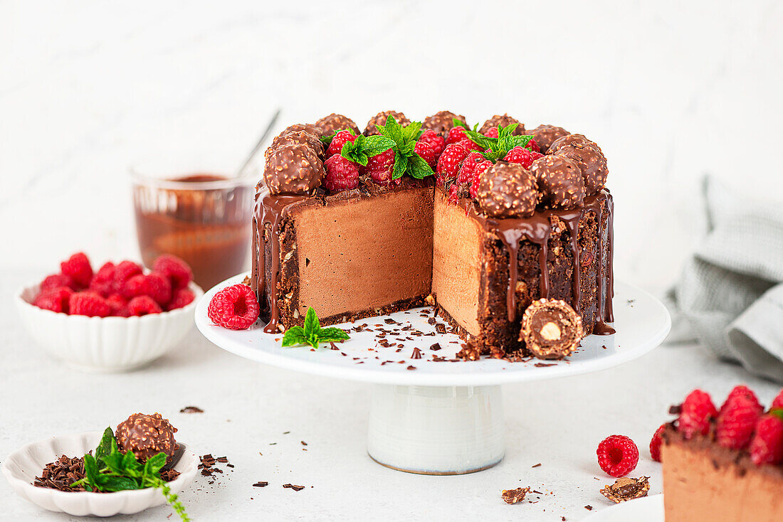 Nougat cheesecake with raspberries and praline balls