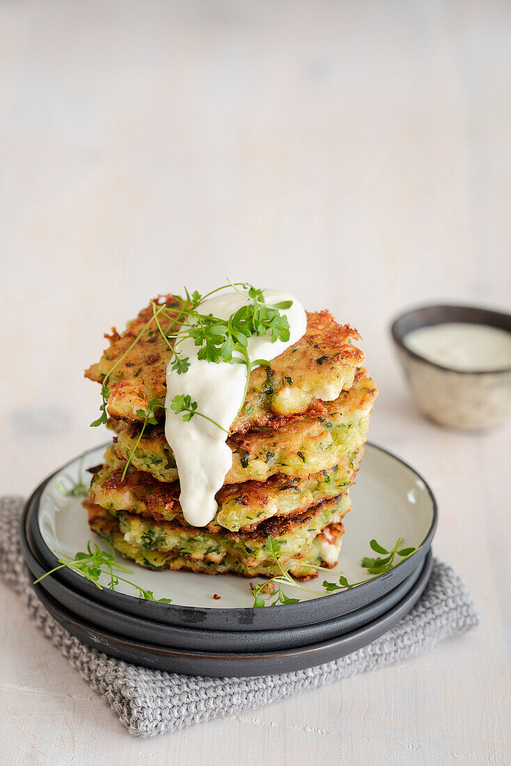 Courgette pancakes with crème fraîche and herbs