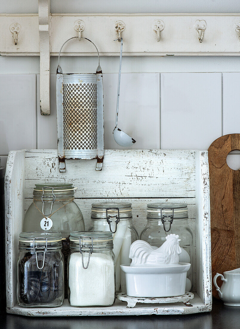 Vintage kitchen decoration with preserving jars and ceramic crock