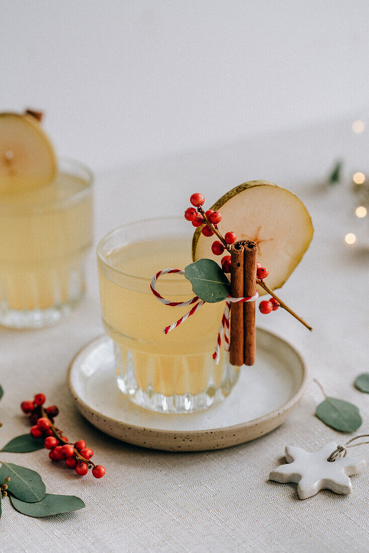 White Christmas punch with pear and cinnamon