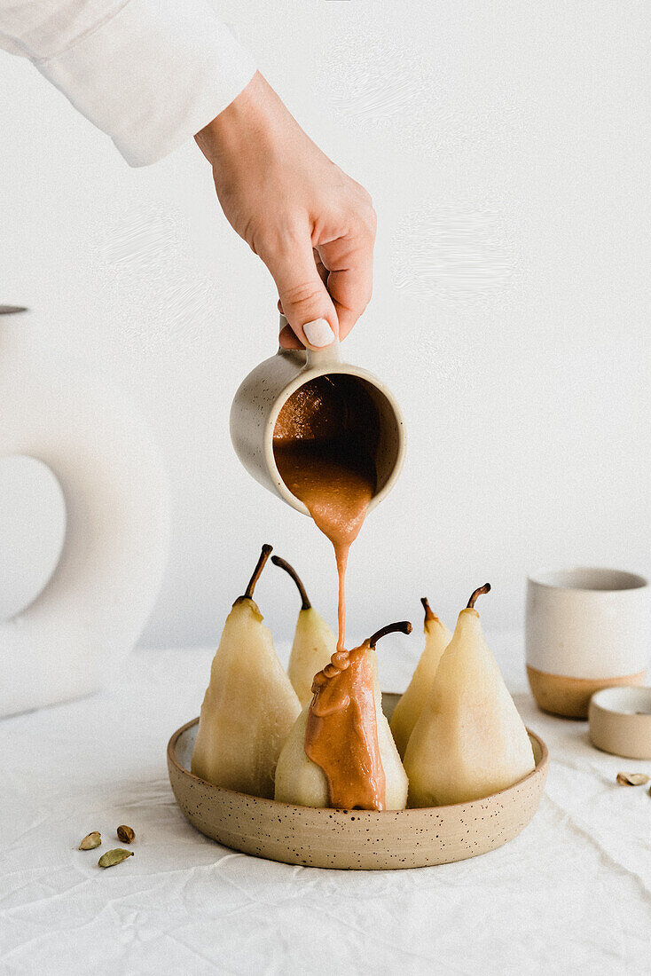 Poached pears with peanut sauce