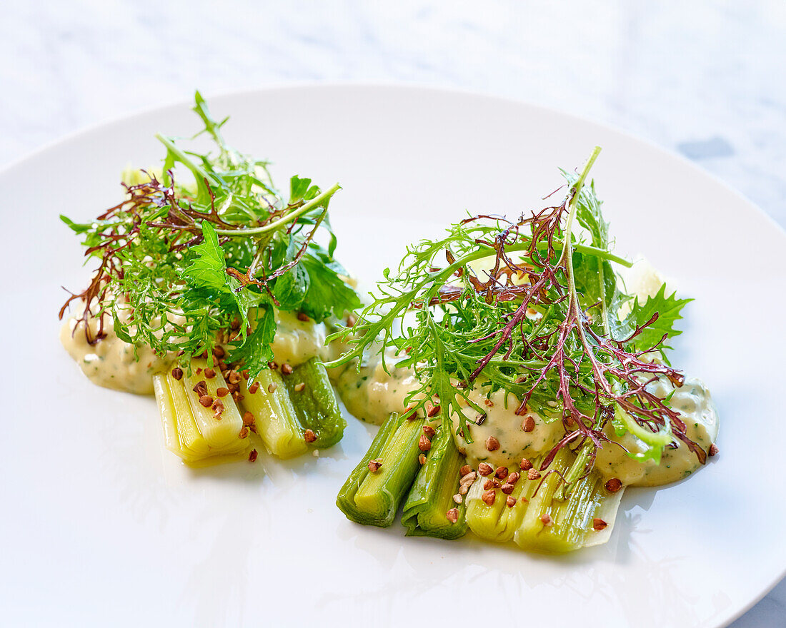 Leek with vinaigrette cream and herb salad