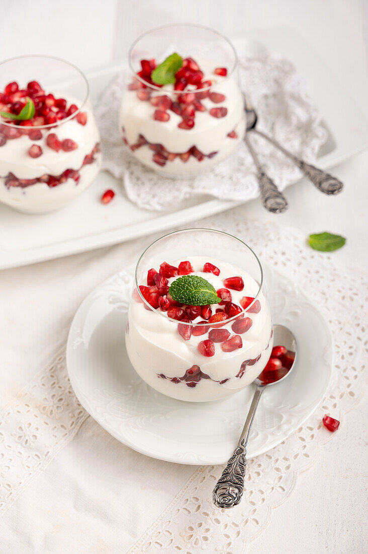 Vegan quark cream pomegranate dessert in a jar