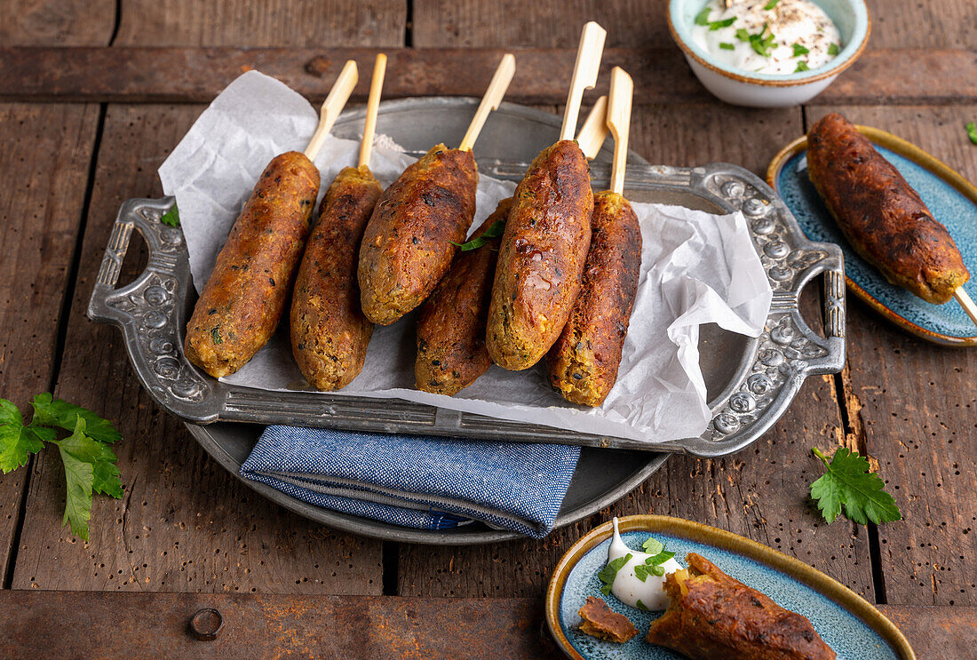 Vegan chickpea and walnut kofta on a skewer