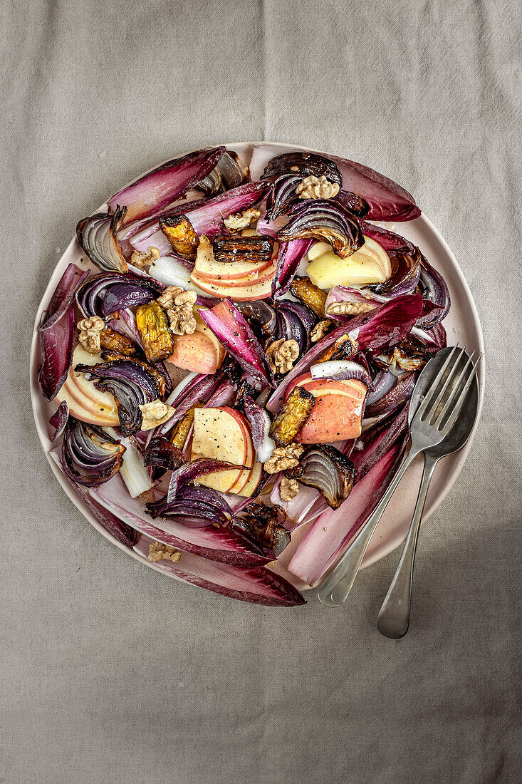 Red chicory salad with roasted yellow beetroot, onions, apples and walnuts