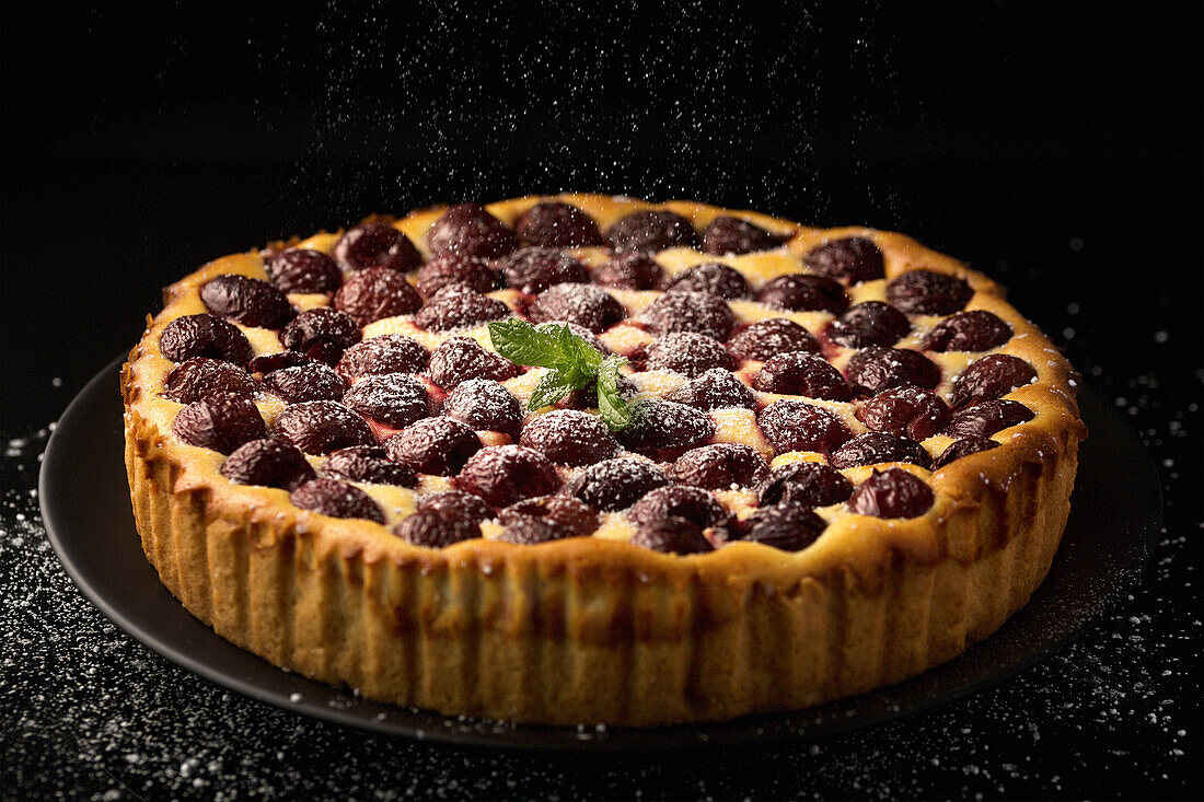 Cherry cheesecake with icing sugar