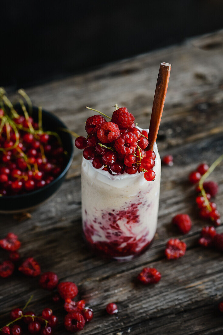 Yoghurt dessert with raspberries and redcurrants