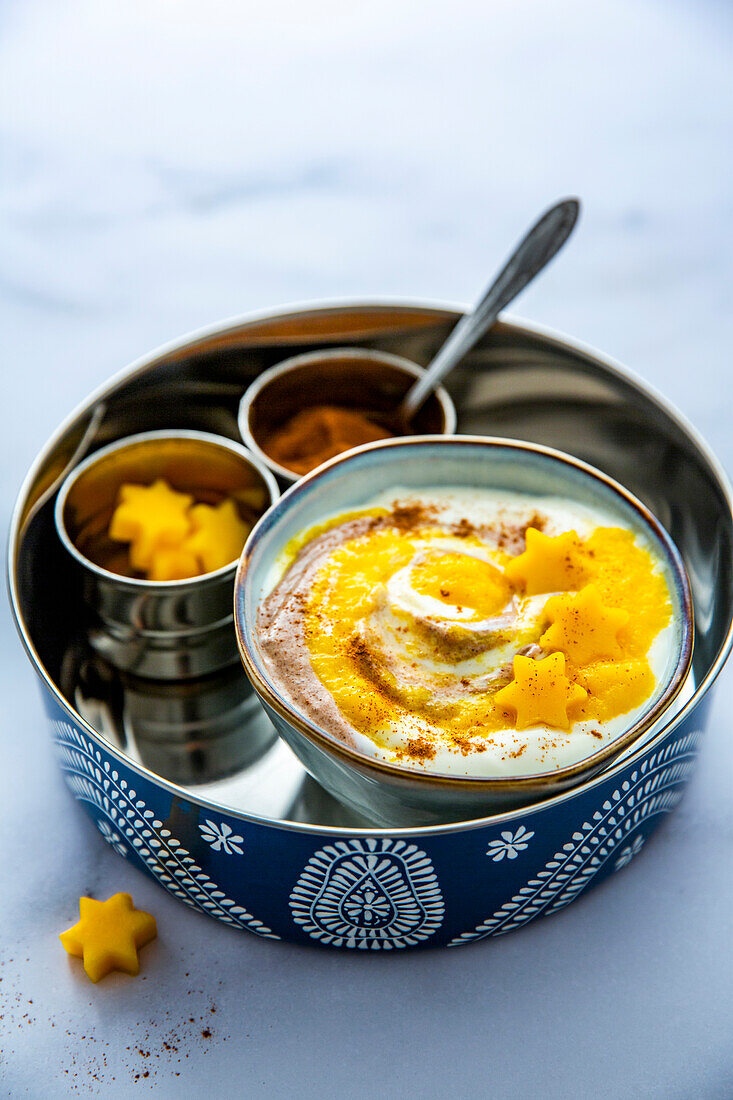 Mango yoghurt bowl with cinnamon swirl