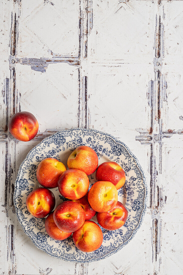 Nectarines on a blue and white plate