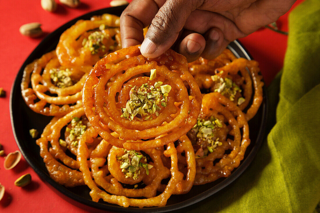 A plate with Jalebis, sweet Indian dessert pastry