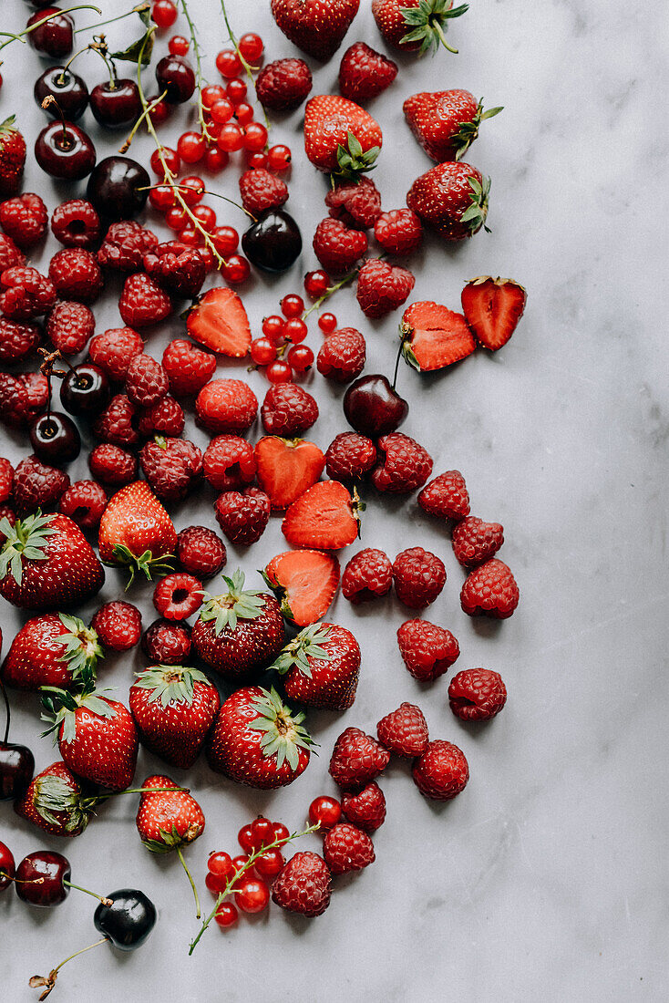 Red summer fruits - strawberries, raspberries, redcurrants and cherries